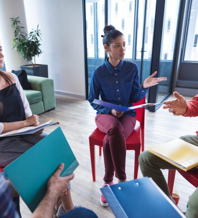 group therapy session in Scottsdale AZ with therapist guiding group discussion at Pathways Counseling Services