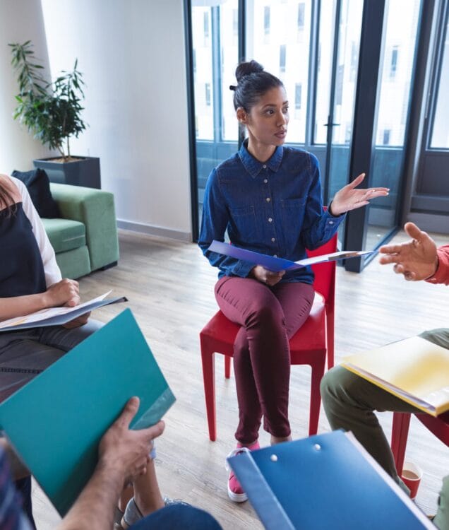 group therapy session in Scottsdale AZ with therapist guiding group discussion at Pathways Counseling Services